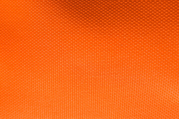 Texture of beautiful orange fabric as background, closeup view