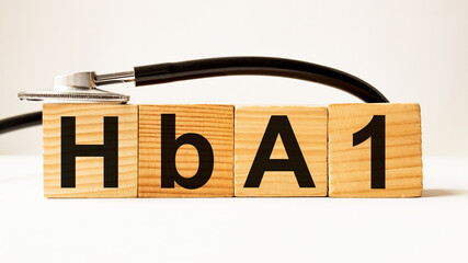 wooden cubes with text HbA1. the medicine. medical concept
