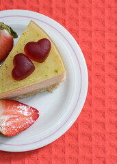 Sweet cheesecake decorated with hearts for International Valentine's Day