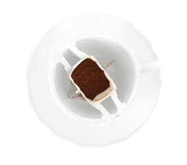 Cup with drip coffee bag isolated on white, top view