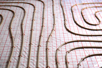 Installation of underfloor heating system in building