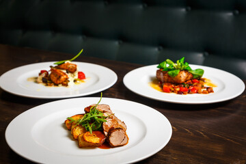 three different dishes of chicken, beef and pork