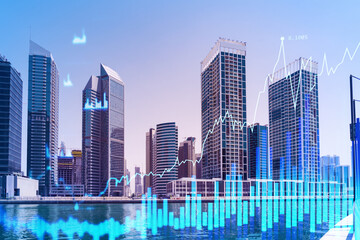 Fototapeta premium Skyscrapers of Dubai business downtown. International hub of trading and financial services of Western Asia. FOREX graph and chart concept. Double exposure. Dubai Canal waterfront.