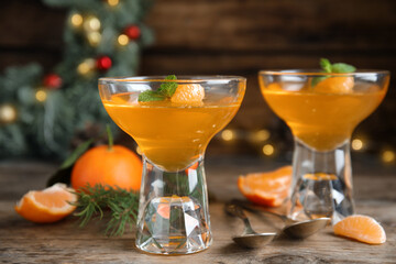 Delicious fresh tangerine jelly on wooden table