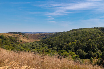 View of the floodplain of the river Vorgol and the surrounding landscape from the top of the cliffs. Tourist and rock climbing place near the city of Yelets, Lipetsk region, Russia