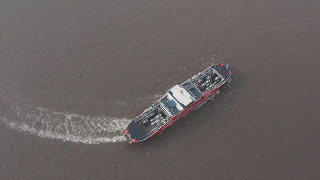 Pull back reveal shot of Mandwa Mumbai car ferry on a hazy day