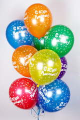 a cloud of helium balloons on a white background. 