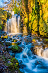 A long exposure panorama view of an upper waterfall section at Lumsdale on Bentley Brook, Derbyshire, UK