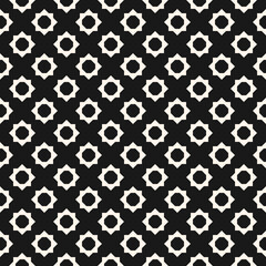 Abstract geometric floral seamless pattern. Vector black and white background. Simple geometric ornament. Monochrome graphic texture with small flower shapes, diamonds, octagons. Dark repeat design