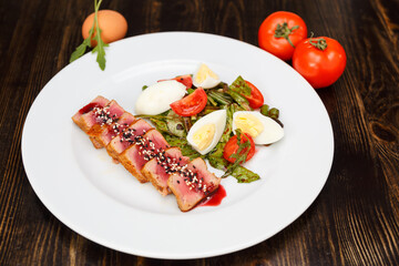 Medium rear beef steak sliced and drizzled with sesame sauce