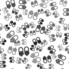 Black Slippers icon isolated seamless pattern on white background. Flip flops sign. Vector.