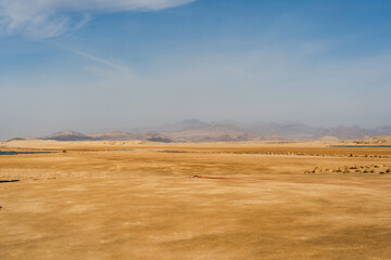 Obraz premium Sandy desert landscape with blue sky of Ras Mohammed national park, Sinai, Egypt