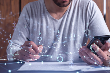 A client is signing the contract to create a software to present it at start up conference and gain investments for innovative service. Checking the details at smartphone. Hologram tech graphs.