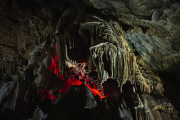 It is an underground cave with stalactites and stalagmites and a glowing crater. Dark and gloomy...