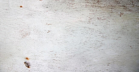 background texture of an old rustic wooden wall with peeling off paint