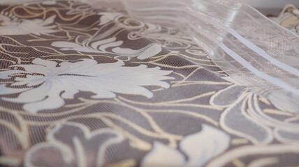 Tape and fabric for curtains close-up. Technological process of sewing curtains.