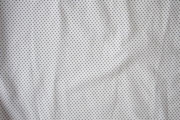 texture cotton fabric in white with a pattern of black dots, background