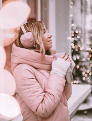 girl with christmas present outdoors in winter
