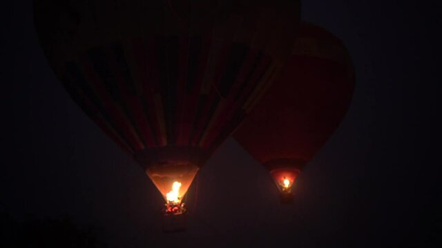Hot air balloon festival, Night light show Ukraine, slow motion. Kiev December 18, 2020 