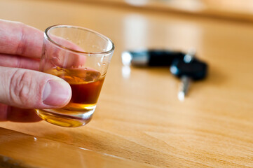 Alcoholic drink and car keys - do not drink and drive concept