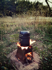 kettle on the campfire - obrazy, fototapety, plakaty