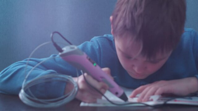 a young man makes a 3 d model with a pen. model in the haze of light.