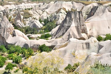 Amazing Cappadocia rocky outdoor landscape, selective focus. Tuff caves, Goreme, Cappadokia, Turkey. Turkish sightseeing attraction. Vertical position 