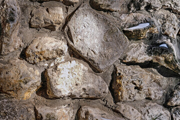 Masonry stone wall.