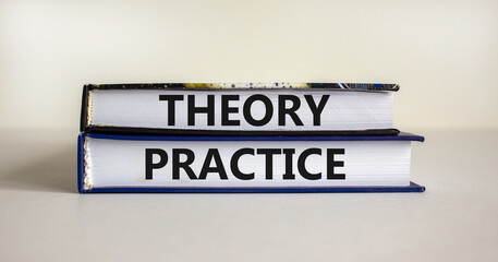 Theory and practice symbol. Books with words 'theory practice' on beautiful white table. White background. Business, theory and practice concept. Copy space.