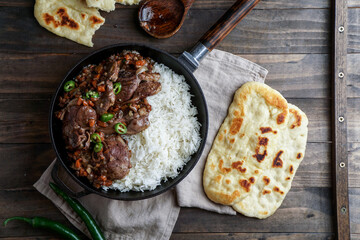 pakistani indian food - lamb with rice and flat bread