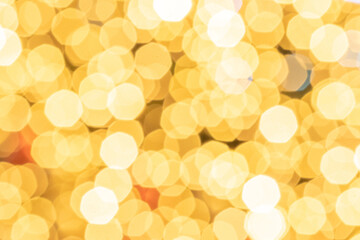 Bokeh background gold glitter abstract lights. Festive blur. Defocused winter backdrop.