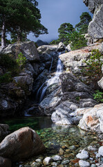 Fototapeta na wymiar The waterfall Cascade des Anglais and the river Agnone, Vivario, Corsica, France