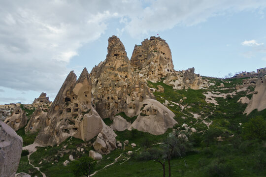 Uchisar castle mountain with surrounding landscape and magnificent stone structures near Goreme at Cappadocia, Anatolia, Turkey