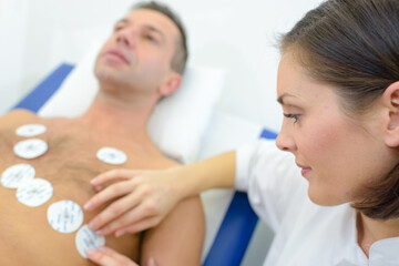 a nurse putting the patches