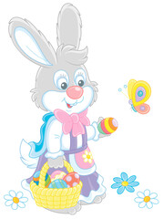 Little Easter Bunny in a colorful holiday dress holding a small wicker basket of painted eggs and playing with a playful butterfly flittering around, vector cartoon illustration isolated on white