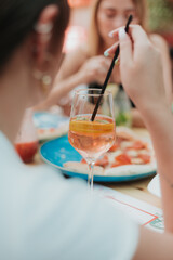 person eating a cocktail