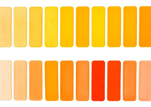 Samples of different shades of yellow and orange in squares on a white background isolated colorful abstract mosaic texture