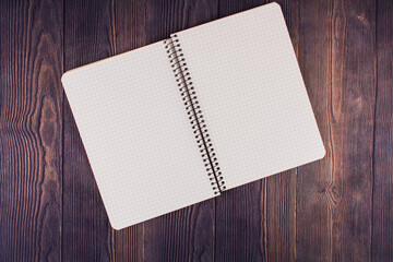 notebook with pen on a wooden table