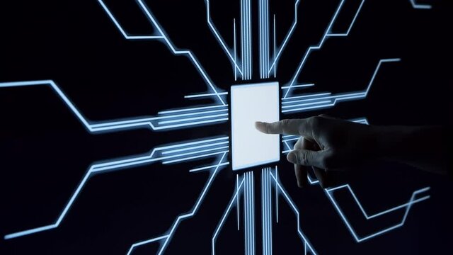 Human finger is pressing a digital button on a glowing touchscreen. Futuristic microprocessor is starting the operation of the computer program. Machine learning and artificial intelligence.