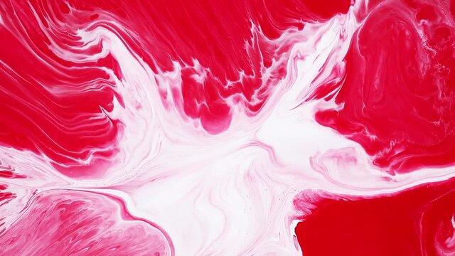 Fluid art painting video, modern acrylic texture with flowing effect. Liquid paint mixing backdrop with splash and swirl. Detailed background motion with red and white overflowing colors