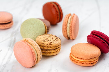 Colorful Fruity Macarons Flat Lay and Top View on White Marble Table