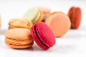 Colorful Fruity Macarons Flat Lay and Top View on White Marble Table