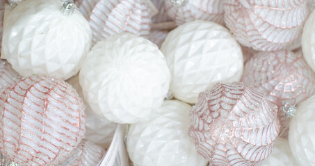 Christmas and New Year decorations. White sparkling balls close-up. Background. 