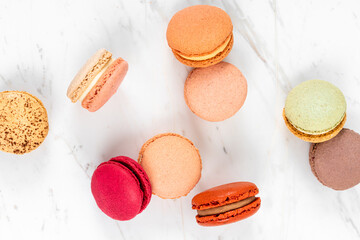 Colorful Fruity Macarons Flat Lay and Top View on White Marble Table