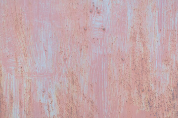 Scratched red-painted metal background. Abstract vintage texture.