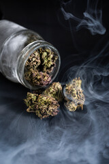glass jar with cannabis buds