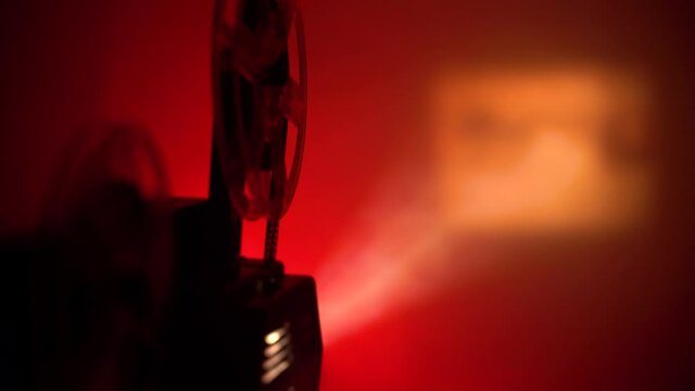 super 8 camera film projector, cinematography red light and smoke
