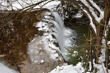 Waterfall on Kwisa  river in winter, Swieradow Zdroj resort,  Poland