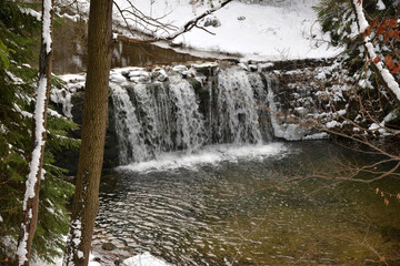 Waterfall on Kwisa  river in winter, Swieradow Zdroj resort,  Poland