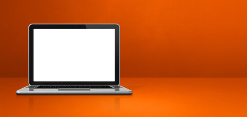 Laptop computer on orange office scene background banner